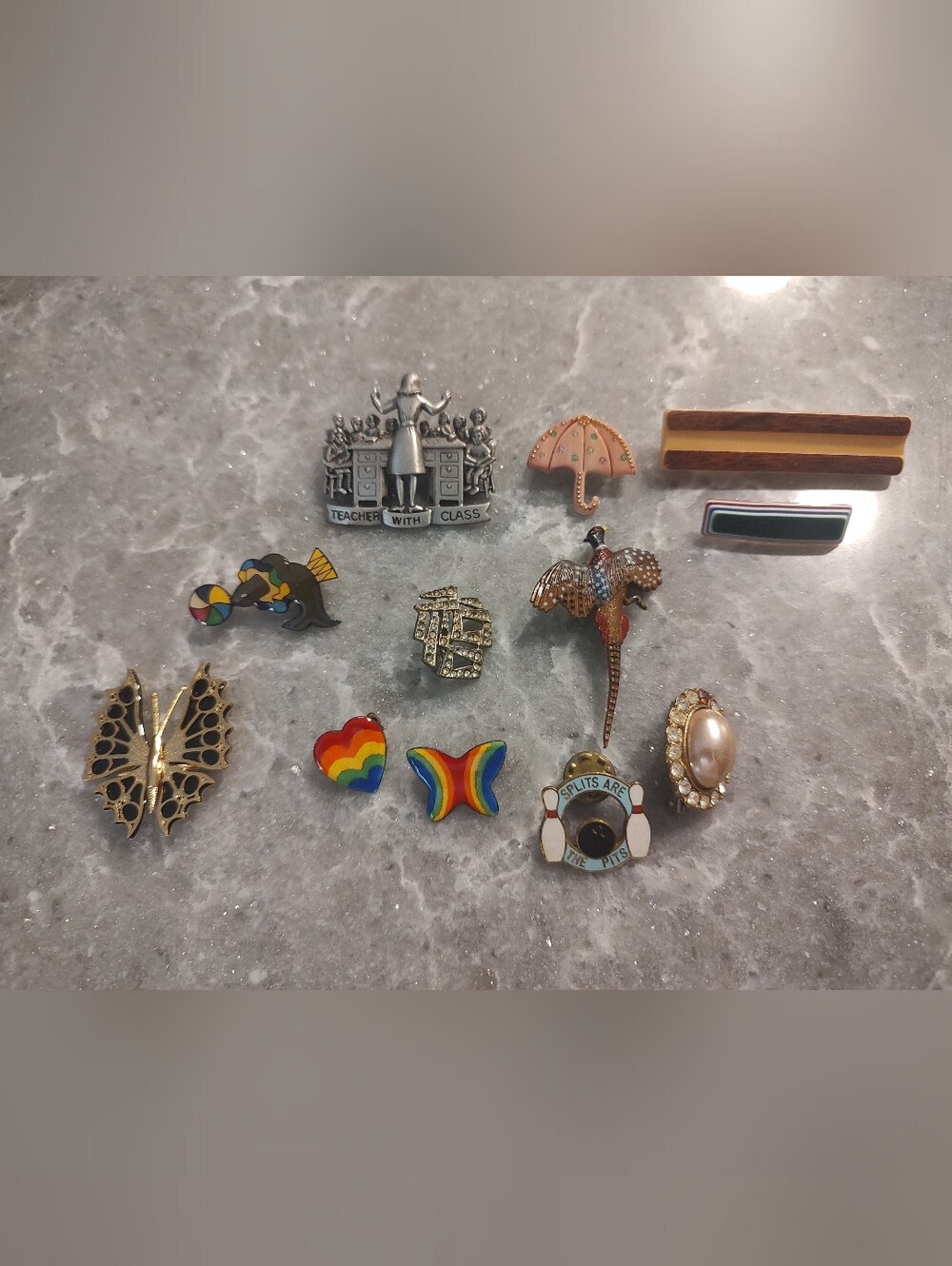 12 assortment of different pins